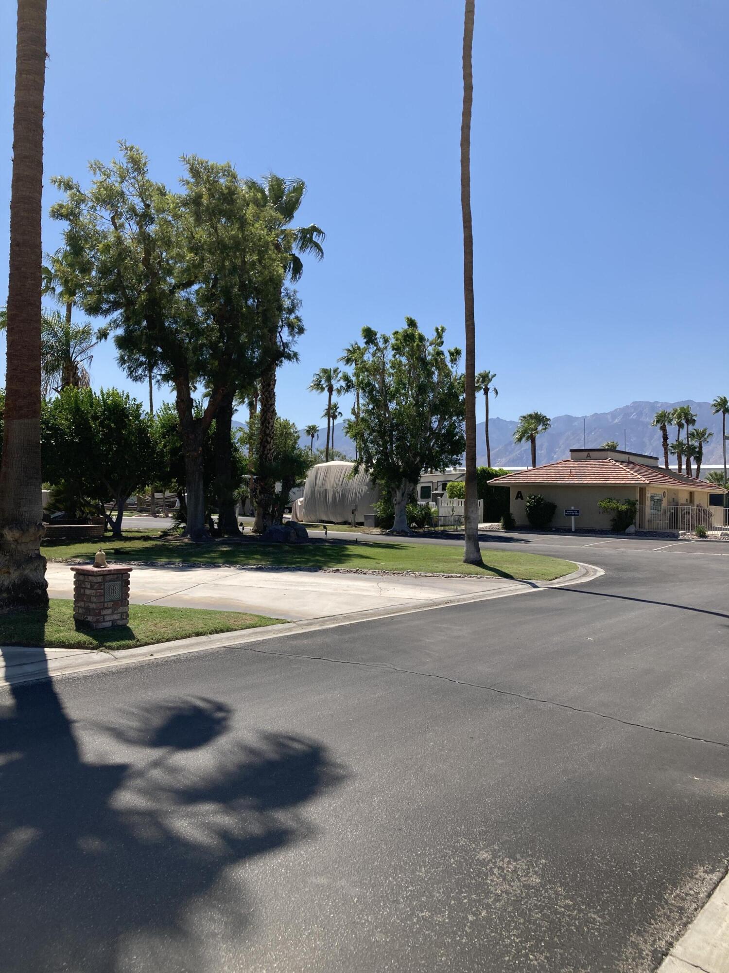 69411 Ramon Road, Unit 65 Cathedral City, CA 92234 - Photo 6 of 6 a swimming pool with outdoor seating and yard