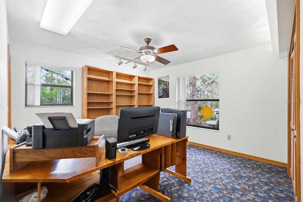 158 Cone Road Ormond Beach, FL 32174 - Photo 11 of 40 a workspace with furniture and a window