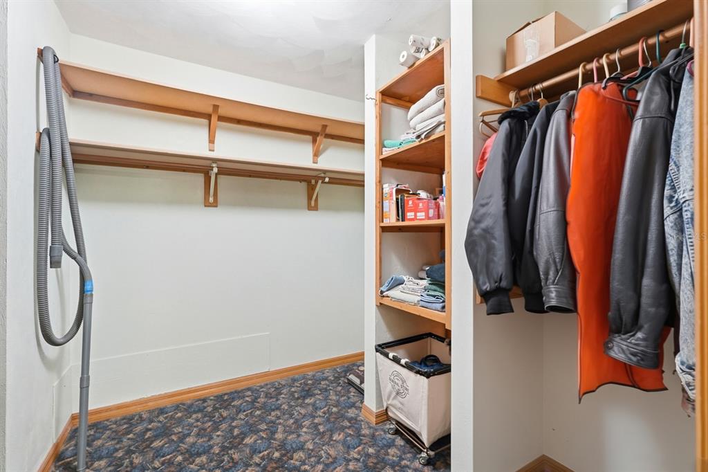 158 Cone Road Ormond Beach, FL 32174 - Photo 20 of 40 a view of walk in closet with clothes and shoes