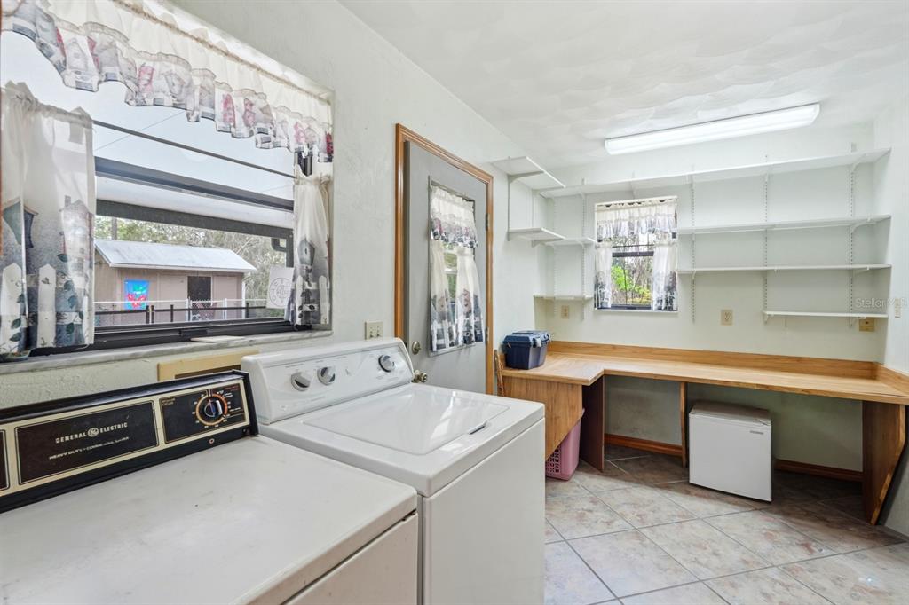 158 Cone Road Ormond Beach, FL 32174 - Photo 21 of 40 a view of a kitchen with stove top oven and cabinets