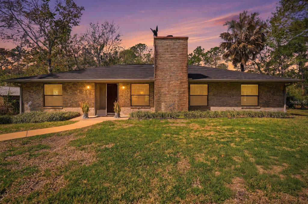 158 Cone Road Ormond Beach, FL 32174 - Photo 22 of 40 front view of house with a yard