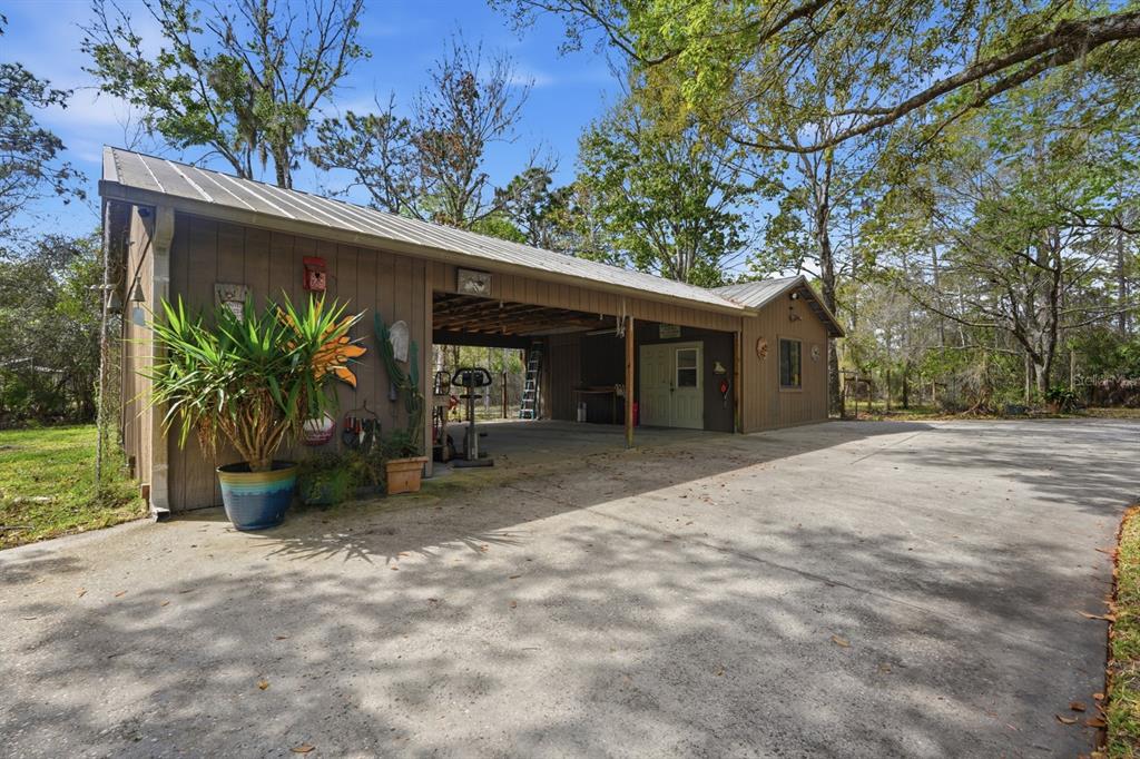 158 Cone Road Ormond Beach, FL 32174 - Photo 26 of 40 a view of a house with a backyard and tree