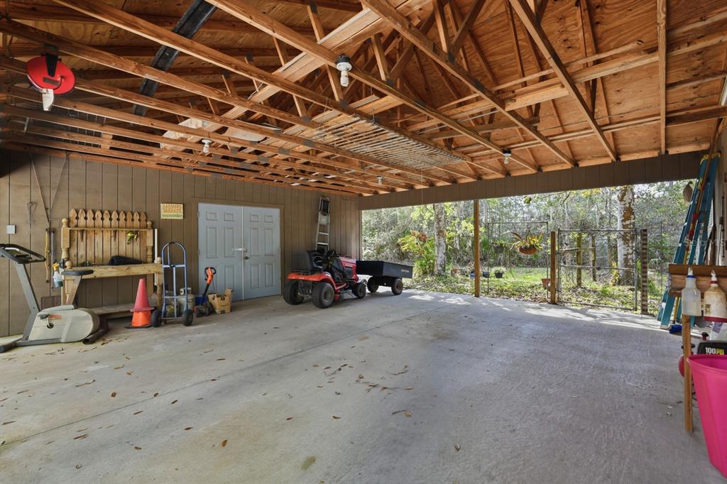 158 Cone Road Ormond Beach, FL 32174 - Photo 27 of 40 a view of a garage with a bike and wooden floors
