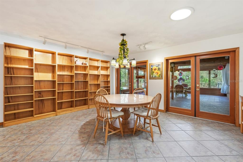 158 Cone Road Ormond Beach, FL 32174 - Photo 7 of 40 a dining room with furniture and chandelier