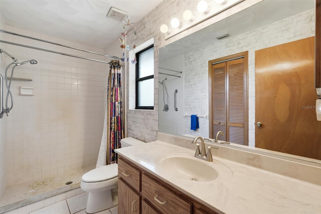 158 Cone Road Ormond Beach, FL 32174 - Photo 10 of 40 a bathroom with a sink toilet and shower