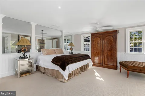 a view of a balcony with couch and a potted plant