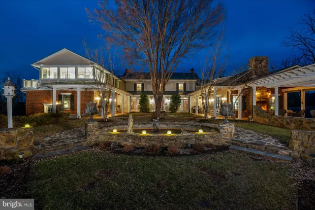 a view of house with yard and green space