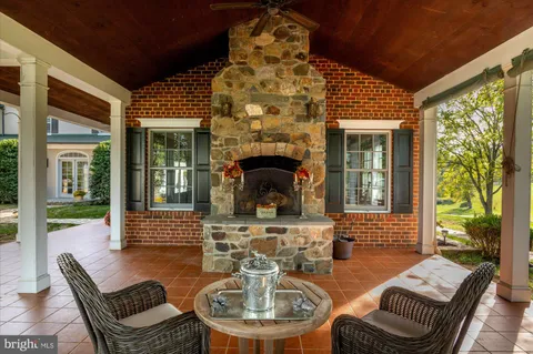 a view of a hallway with wooden floors and stairs