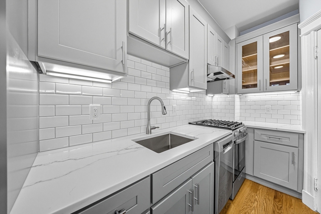 4 Crawford Street, Unit U4 Cambridge, MA 02139 - Photo 11 of 22 a kitchen with a sink and cabinets