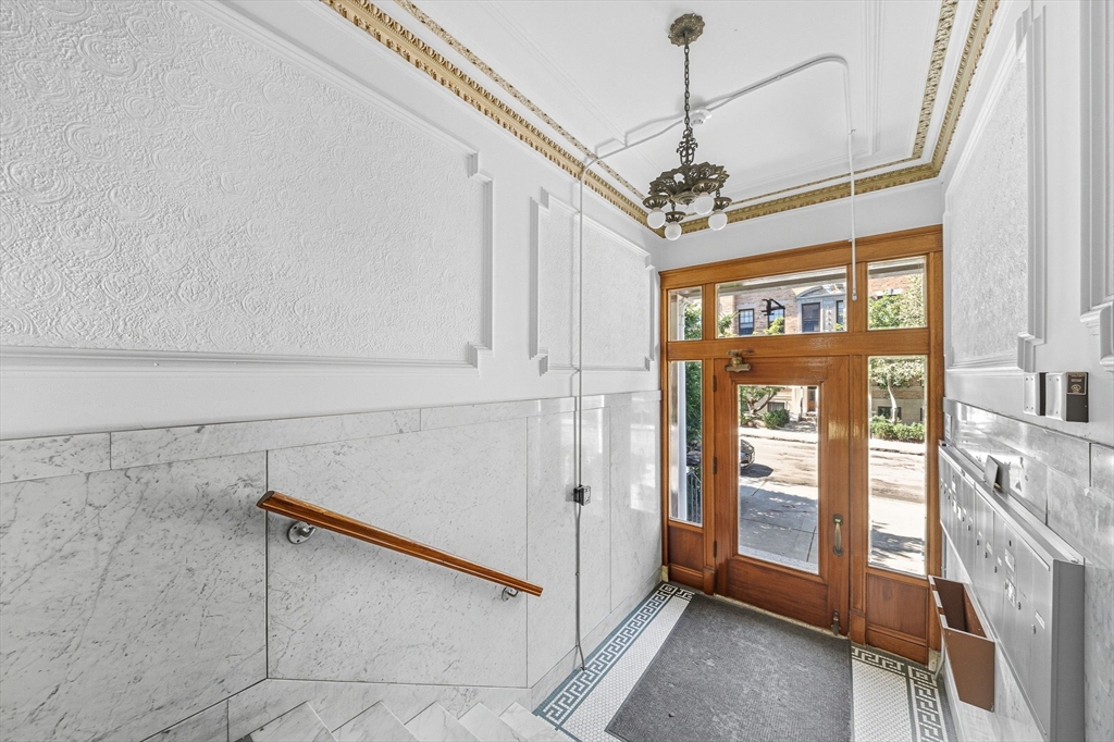 4 Crawford Street, Unit U4 Cambridge, MA 02139 - Photo 17 of 22 a view of a livingroom with a staircase