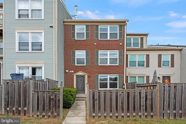 a front view of residential houses with deck