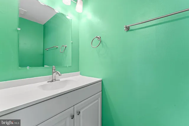 a bathroom with a sink and mirror