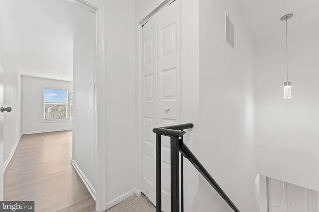 a view of a hallway with the door