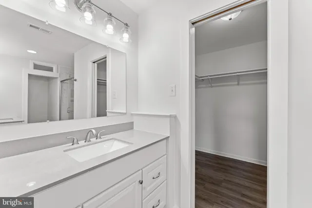 a bathroom with a sink double vanity and a mirror