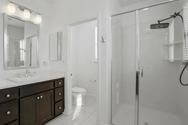 a bathroom with a double vanity sink and mirror