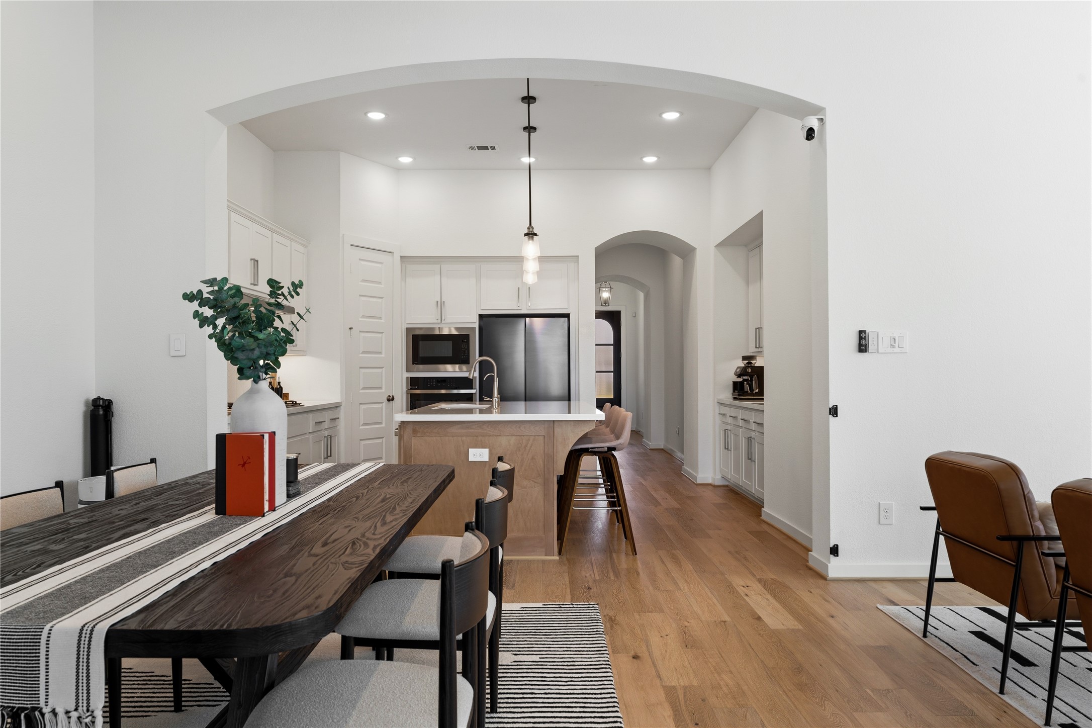 416 Bartlett Street Webster, TX 77598 - Photo 11 of 49 Open dining room framed by arched opening to kitchen and living area
