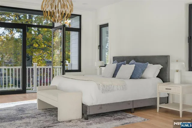 a bedroom with a bed and a lamp