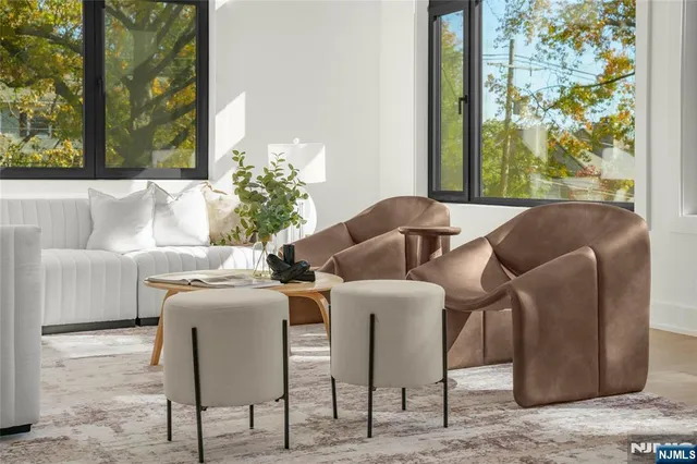 a living room with furniture and a floor to ceiling window