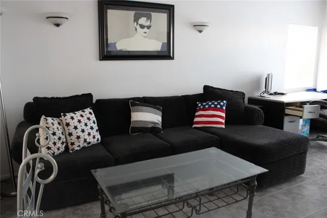 a living room with furniture and a couch