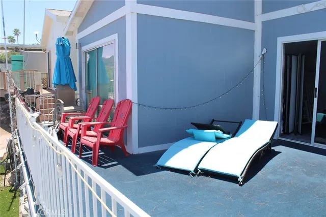 a view of a balcony with chairs