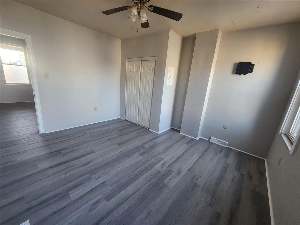 306 Campbell Street McKees Rocks, PA 15136 - Photo 12 of 28 wooden floor in an empty room with a window