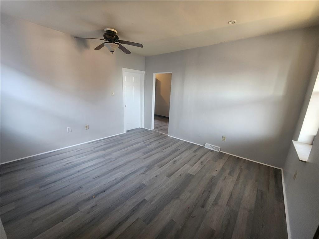 306 Campbell Street McKees Rocks, PA 15136 - Photo 2 of 28 a view of a room with wooden floor and white walls