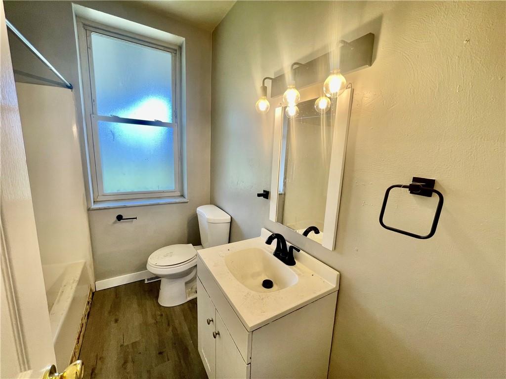 306 Campbell Street McKees Rocks, PA 15136 - Photo 21 of 28 a bathroom with a toilet sink and mirror