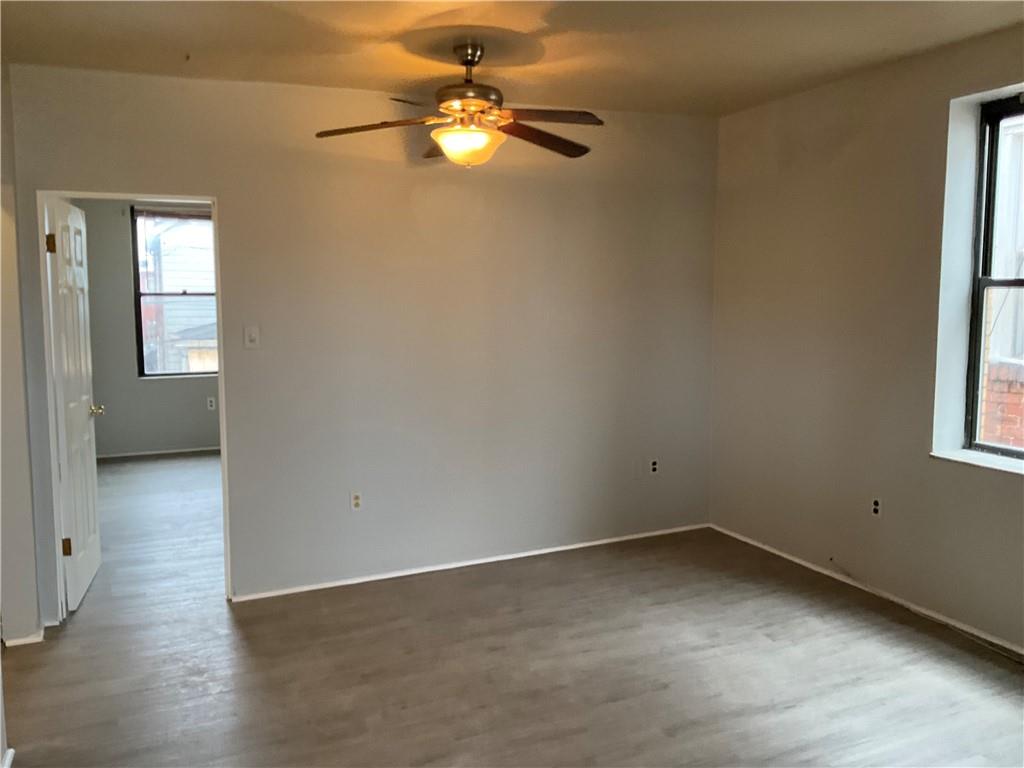 306 Campbell Street McKees Rocks, PA 15136 - Photo 24 of 28 an empty room with windows and fan