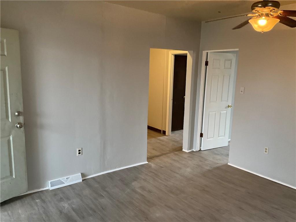 306 Campbell Street McKees Rocks, PA 15136 - Photo 27 of 28 a view of an empty room with wooden floor and window