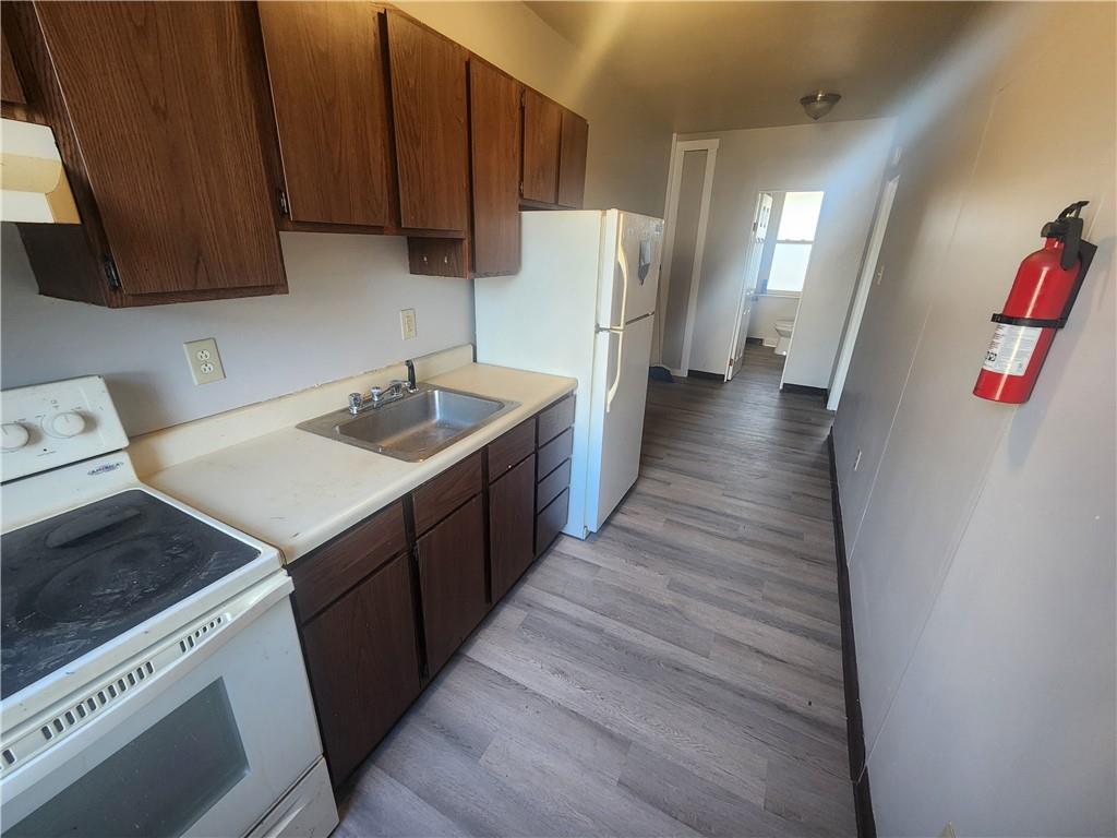 306 Campbell Street McKees Rocks, PA 15136 - Photo 7 of 28 a kitchen with a sink and a refrigerator