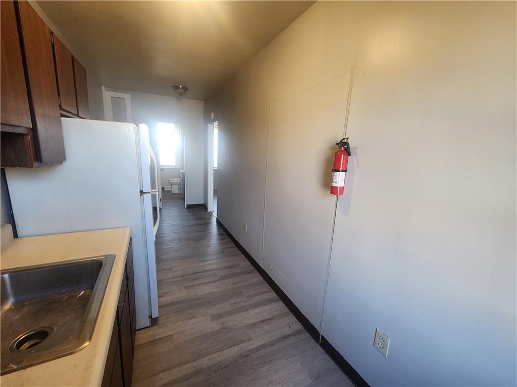 306 Campbell Street McKees Rocks, PA 15136 - Photo 8 of 28 a view of a hallway with wooden floor