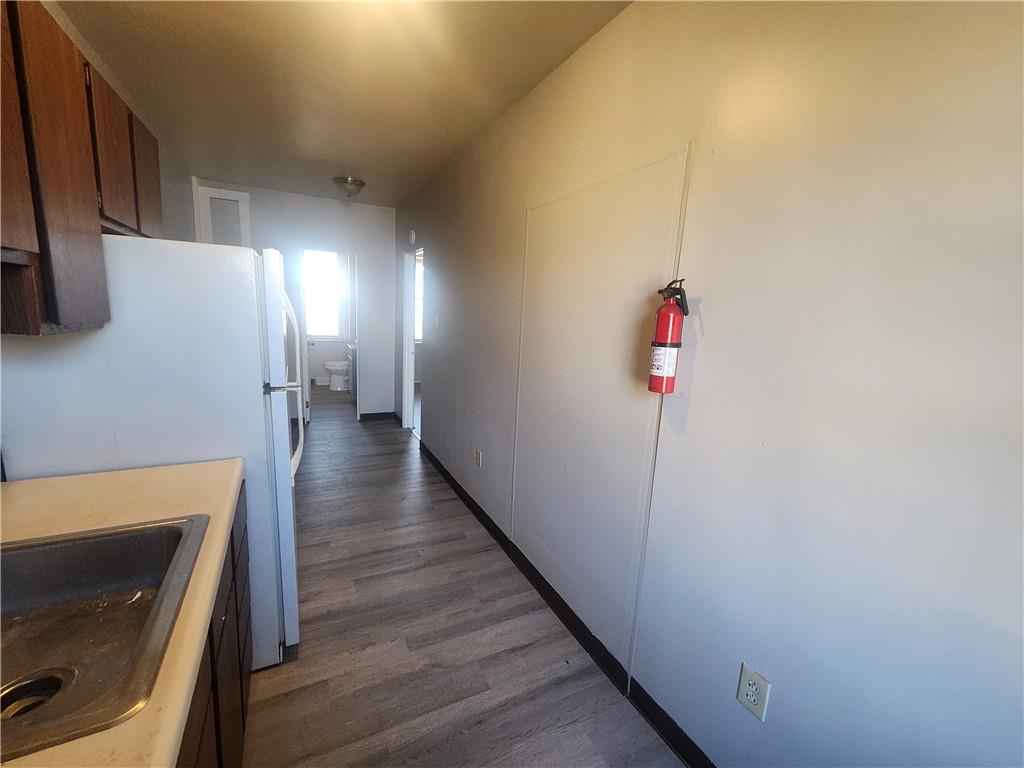 306 Campbell Street McKees Rocks, PA 15136 - Photo 9 of 28 a view of a hallway view with wooden floor and staircase