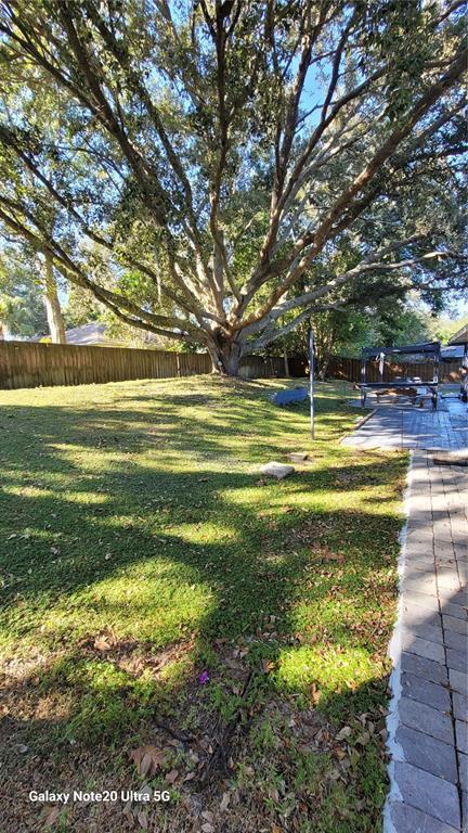 11028 Versailles Boulevard Clermont, FL 34711 - Photo 20 of 21 a view of a swimming pool with an outdoor space and seating area