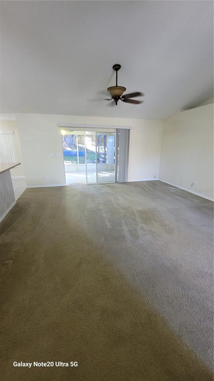 11028 Versailles Boulevard Clermont, FL 34711 - Photo 5 of 21 a view of an empty room and chandelier fan