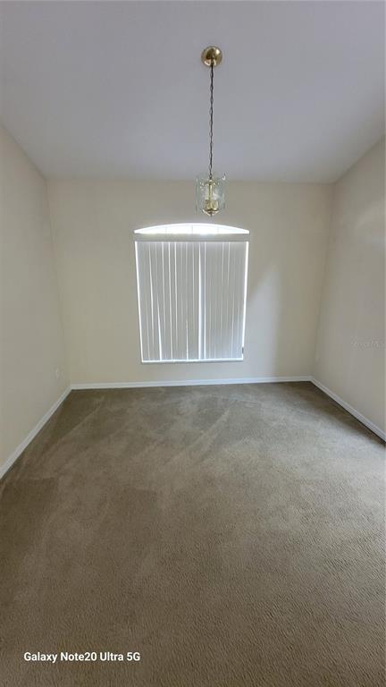 11028 Versailles Boulevard Clermont, FL 34711 - Photo 7 of 21 a view of an empty room and window