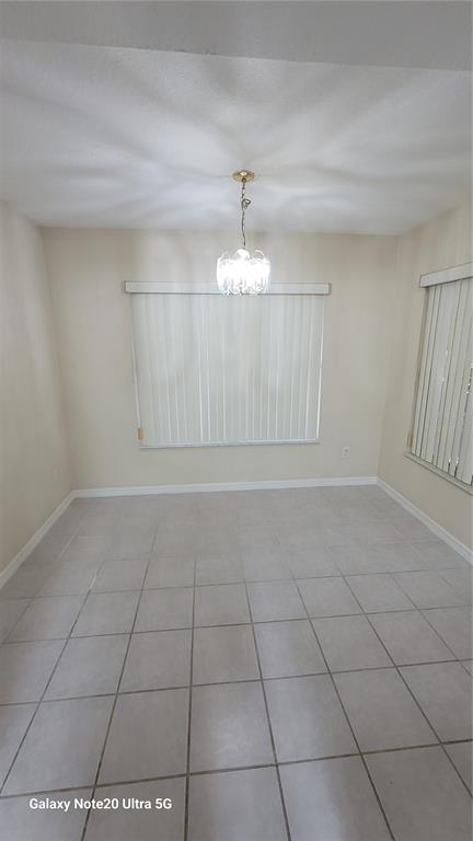 11028 Versailles Boulevard Clermont, FL 34711 - Photo 8 of 21 a view of an empty room and window