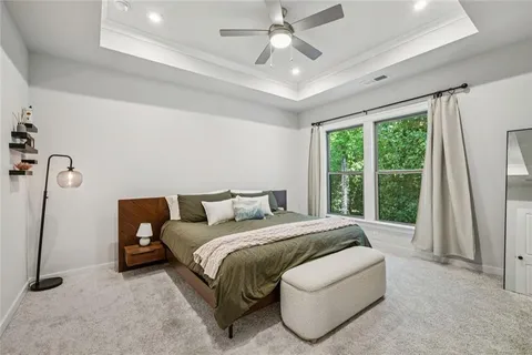 a large kitchen with kitchen island a large island a sink a stove and a wooden floors