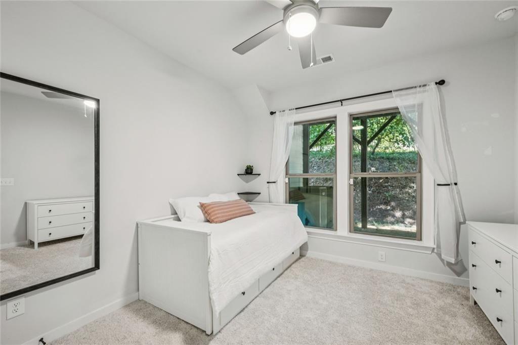 1332 Stanley Park Drive Decatur, GA 30033 - Photo 41 of 75 a bedroom with a bed and a chandelier