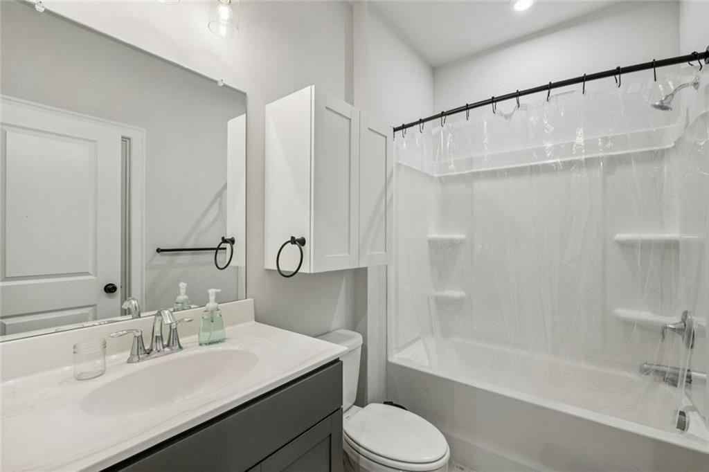 1332 Stanley Park Drive Decatur, GA 30033 - Photo 42 of 75 a bathroom with a sink mirror toilet and bathtub
