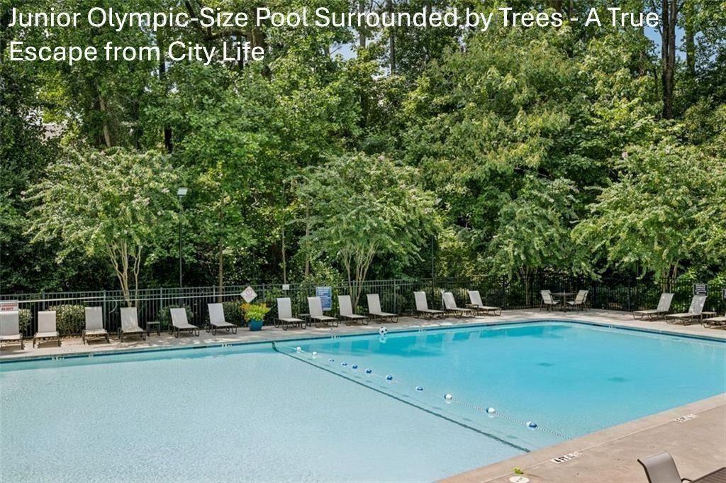 1332 Stanley Park Drive Decatur, GA 30033 - Photo 51 of 75 a view of a swimming pool with a bench