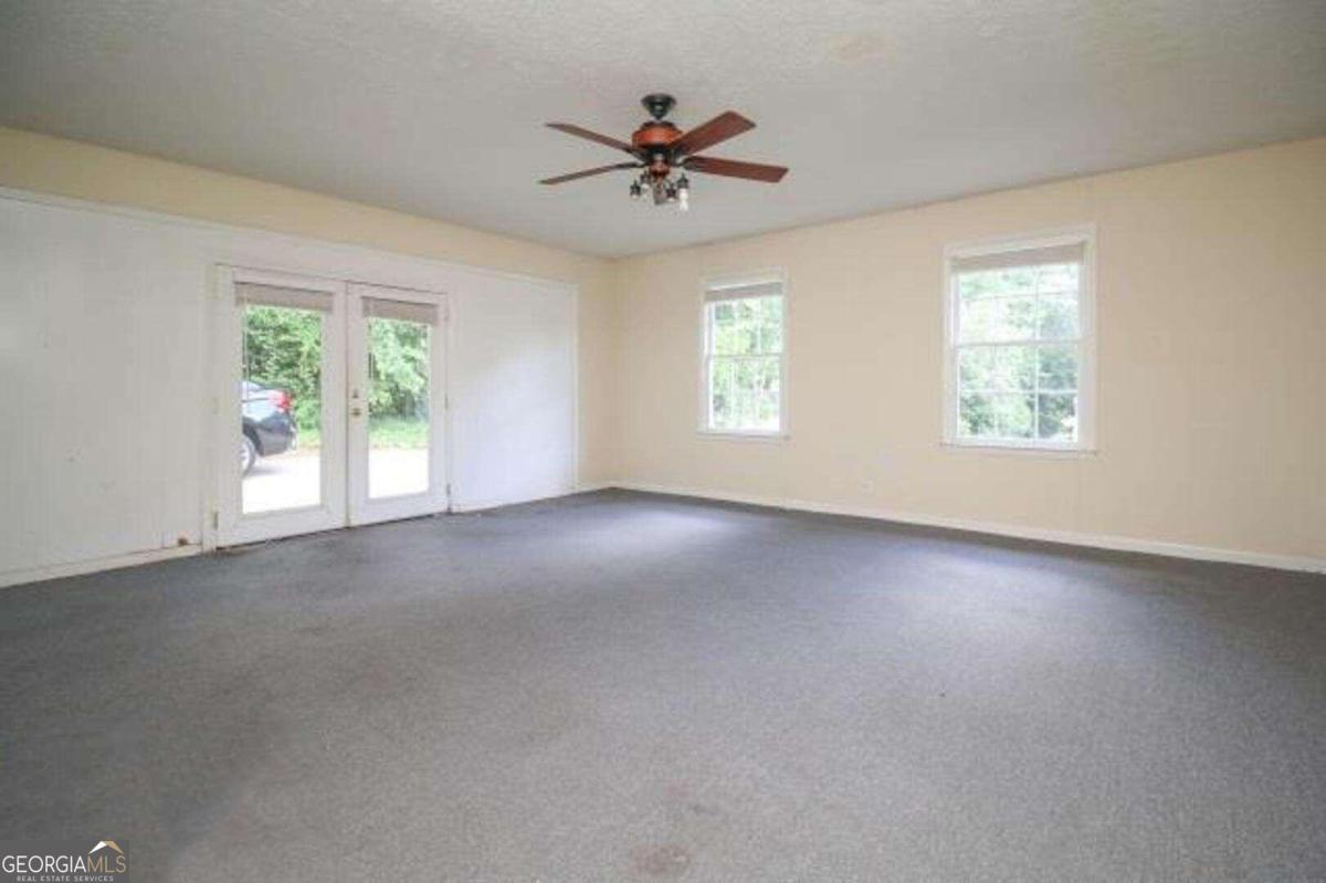 220 Providence Road Athens, GA 30606 - Photo 14 of 15 wooden floor in an empty room with a window