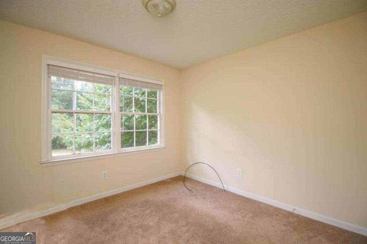 220 Providence Road Athens, GA 30606 - Photo 10 of 15 an empty room with a window