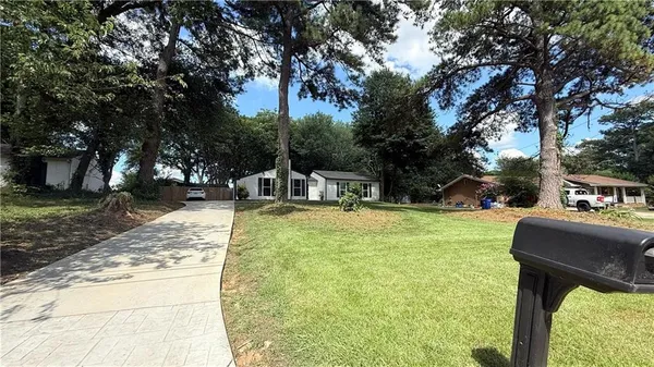 a view of a swimming pool with a patio