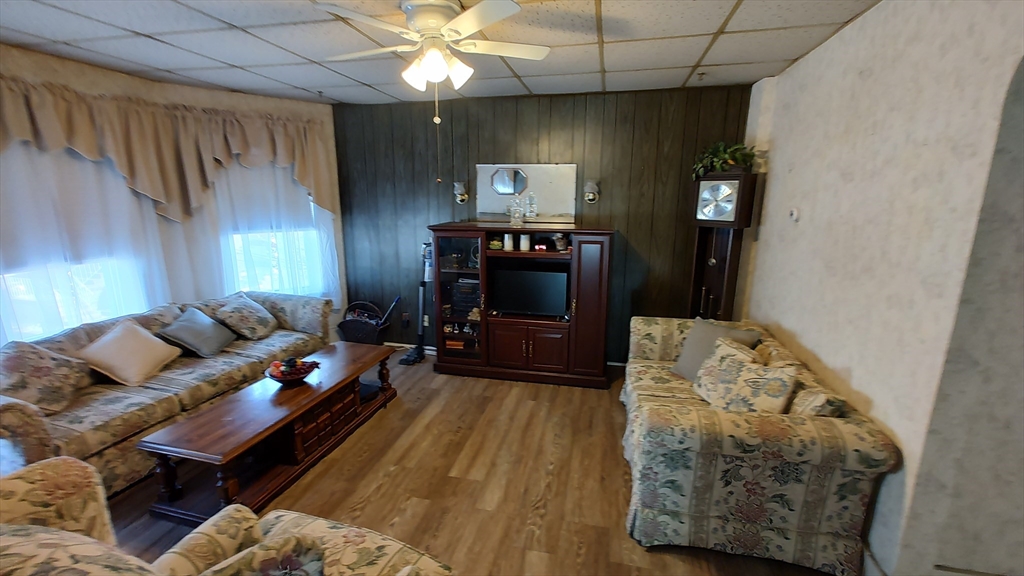 46 Irving Street Everett, MA 02149 - Photo 18 of 42 a living room with furniture and a fireplace
