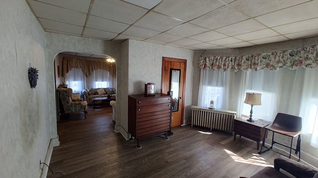 46 Irving Street Everett, MA 02149 - Photo 19 of 42 a room with furniture and a wooden floor