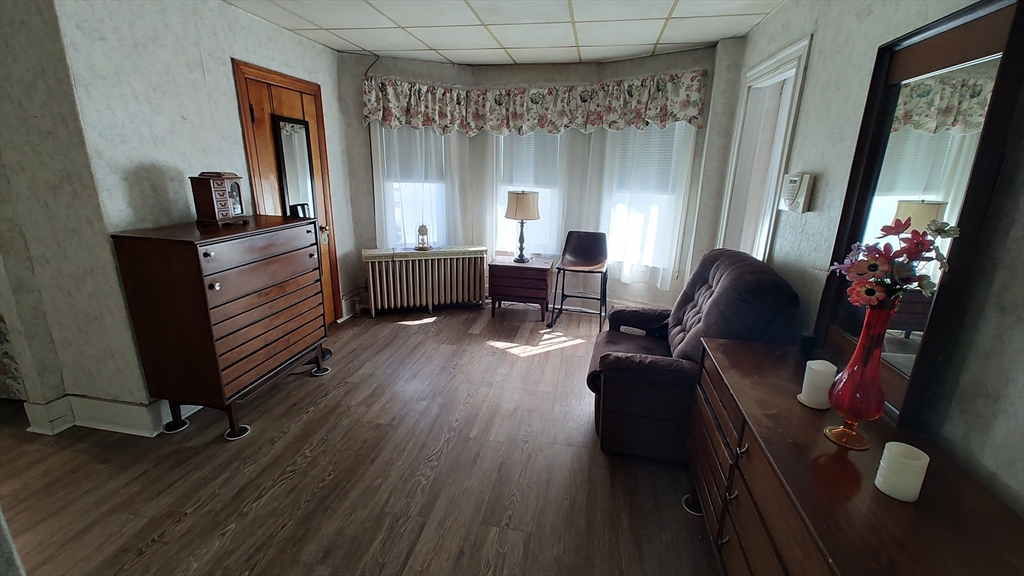 46 Irving Street Everett, MA 02149 - Photo 20 of 42 a living room with furniture and a window