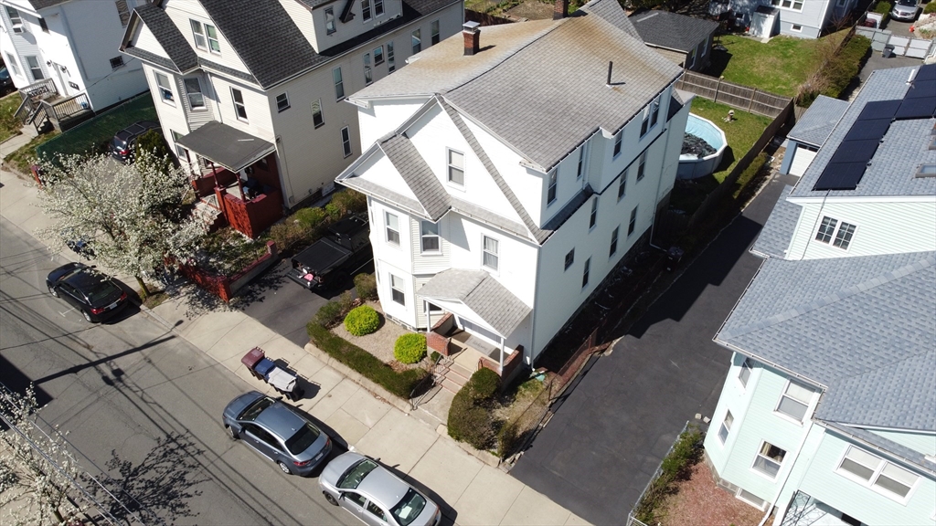 46 Irving Street Everett, MA 02149 - Photo 2 of 42 an aerial view of a house with outdoor space
