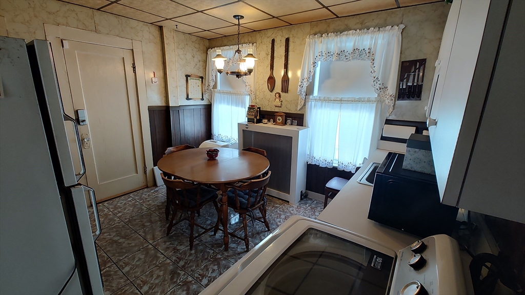 46 Irving Street Everett, MA 02149 - Photo 21 of 42 a view of kitchen with sink refrigerator and microwave