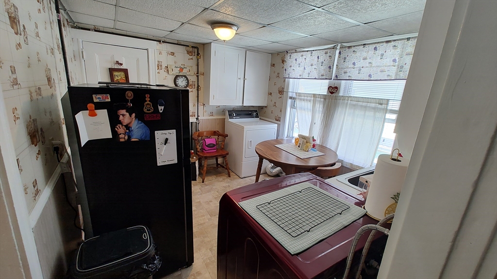 46 Irving Street Everett, MA 02149 - Photo 28 of 42 a view of a kitchen with fridge and workspace