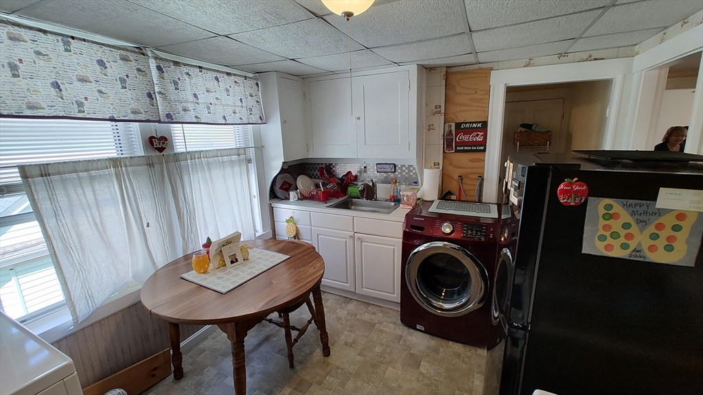 46 Irving Street Everett, MA 02149 - Photo 29 of 42 a view of a sink and washer in a room